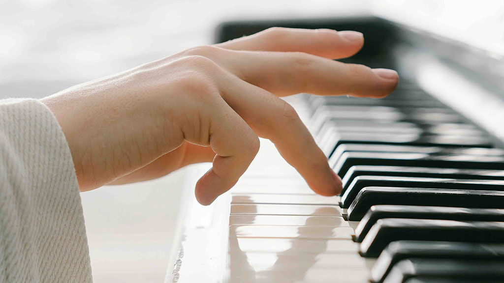 Hands playing piano